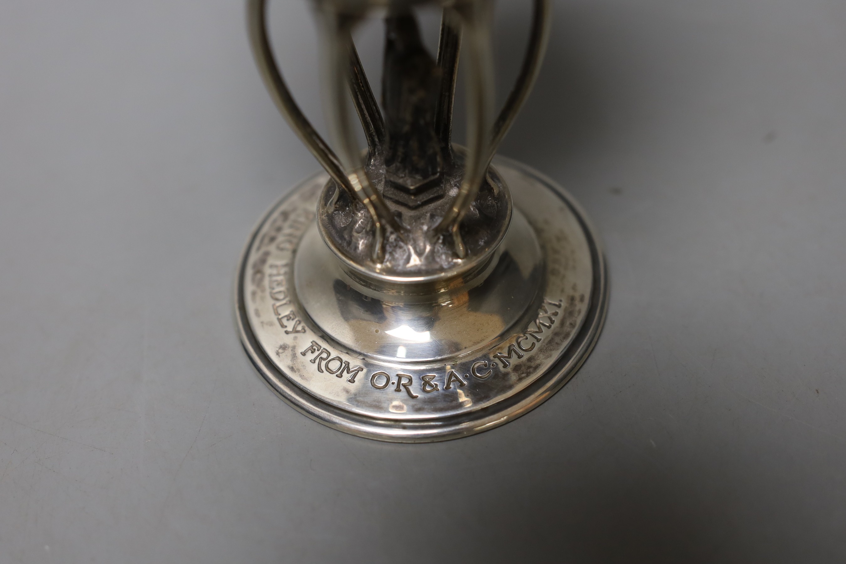 A George V Arts & Crafts planished silver presentation ecclesiastical goblet by Ramsden & Carr, with engraved inscription, London, 1911, 13.5cm, 152 grams.